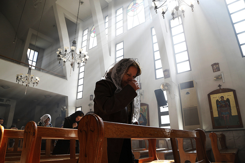 Woman Praying in a Church in MIddle East