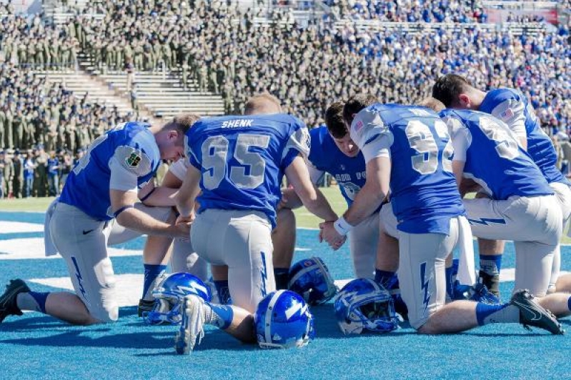 Praying at Football Game