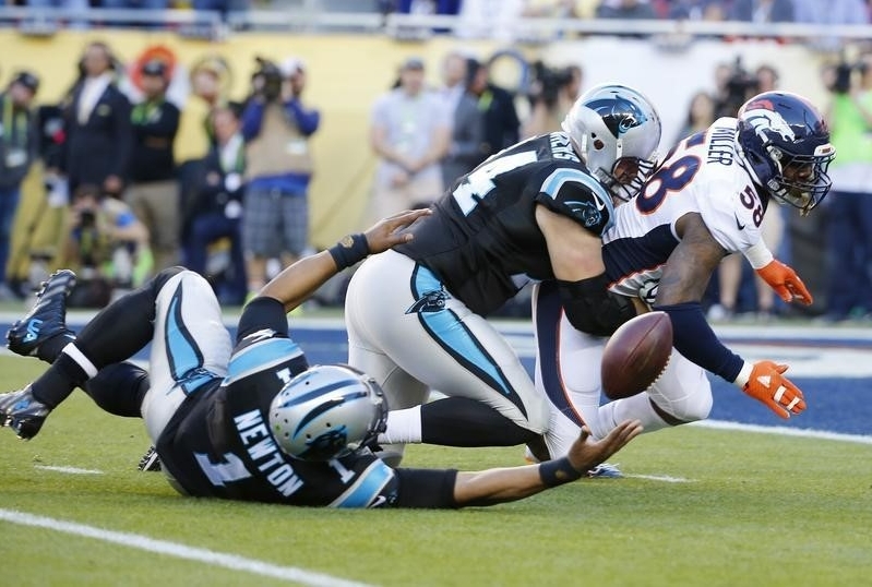 Carolina Panthers' Newton loses the ball after being sacked by Broncos' Miller as Panthers' Remmers tries to block in the first quarter during the NFL's Super Bowl 50 football game in Santa Clara