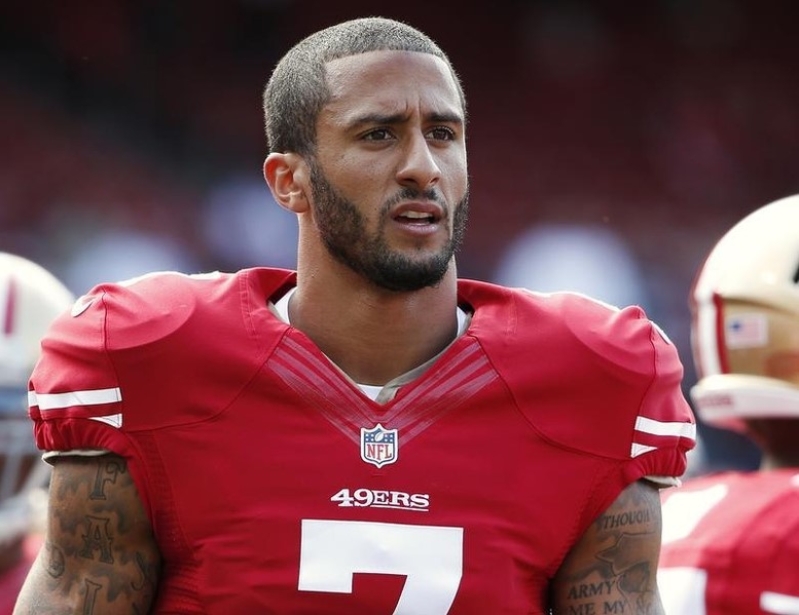 San Francisco 49ers' Kaepernick stands on the field before their NFL pre-season football game against Denver Broncos in San Francisco