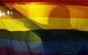 Gay Rights Activist Holding LGBT Flag