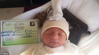 ISIS Releases Propaganda Image of Newborn Sleeping Next to Gun, Hand Grenade: 'This Child Will Be a Risk to You'
