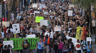 Residents Hold ‘Unity March’ in Memory of Charleston Church Shooting Victims; Stephen Colbert Makes an Appearance