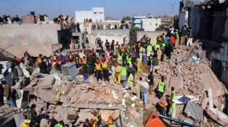 Pakistan Factory Collapses, Killing At Least 18, Scores Trapped