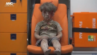 Heartbreaking Video Shows Dazed Little Boy Pulled from Aleppo Rubble